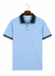 Light Blue Polo Shirt on Wooden Hanger